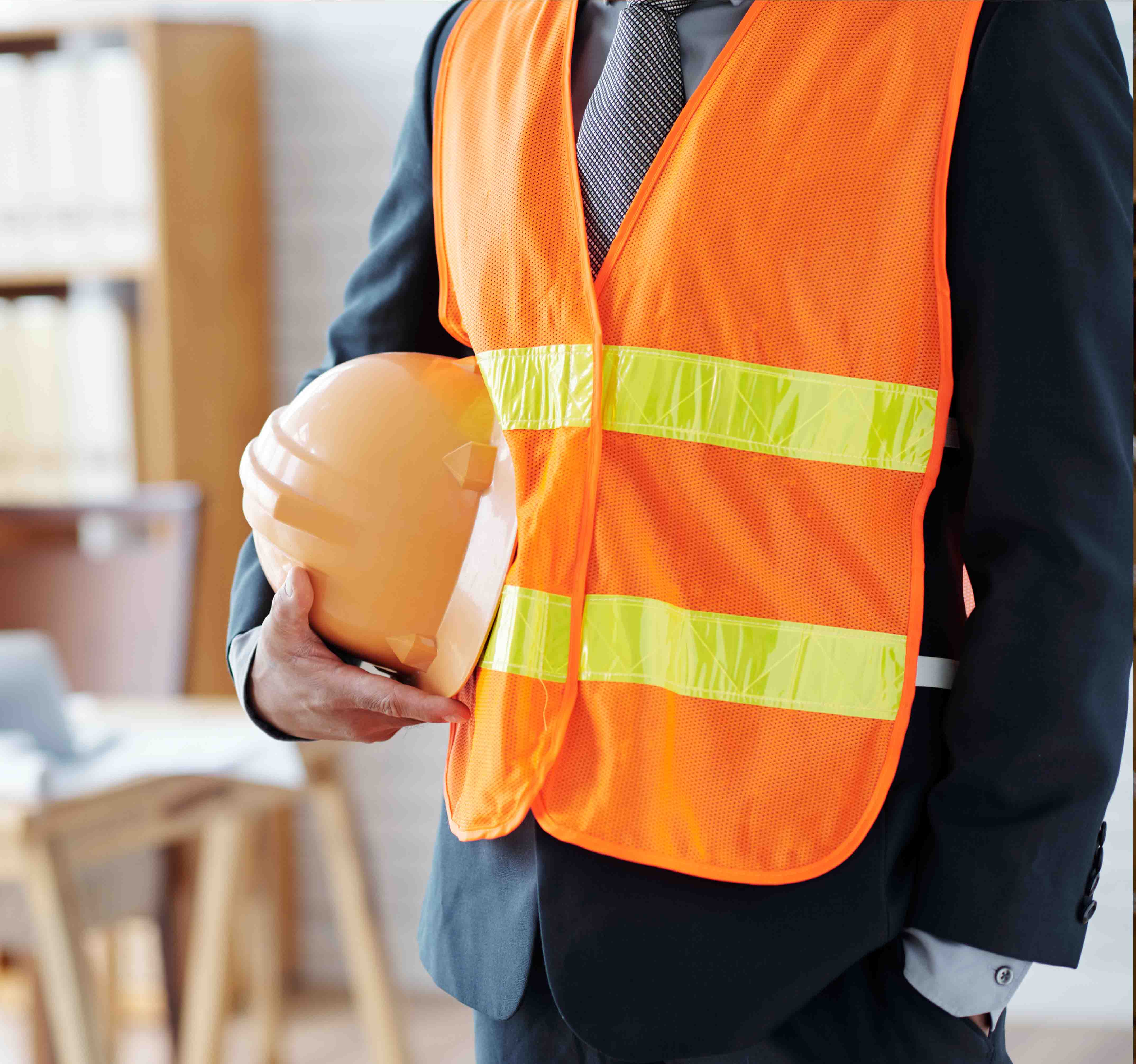 Workers in safety equipment at an industrial site