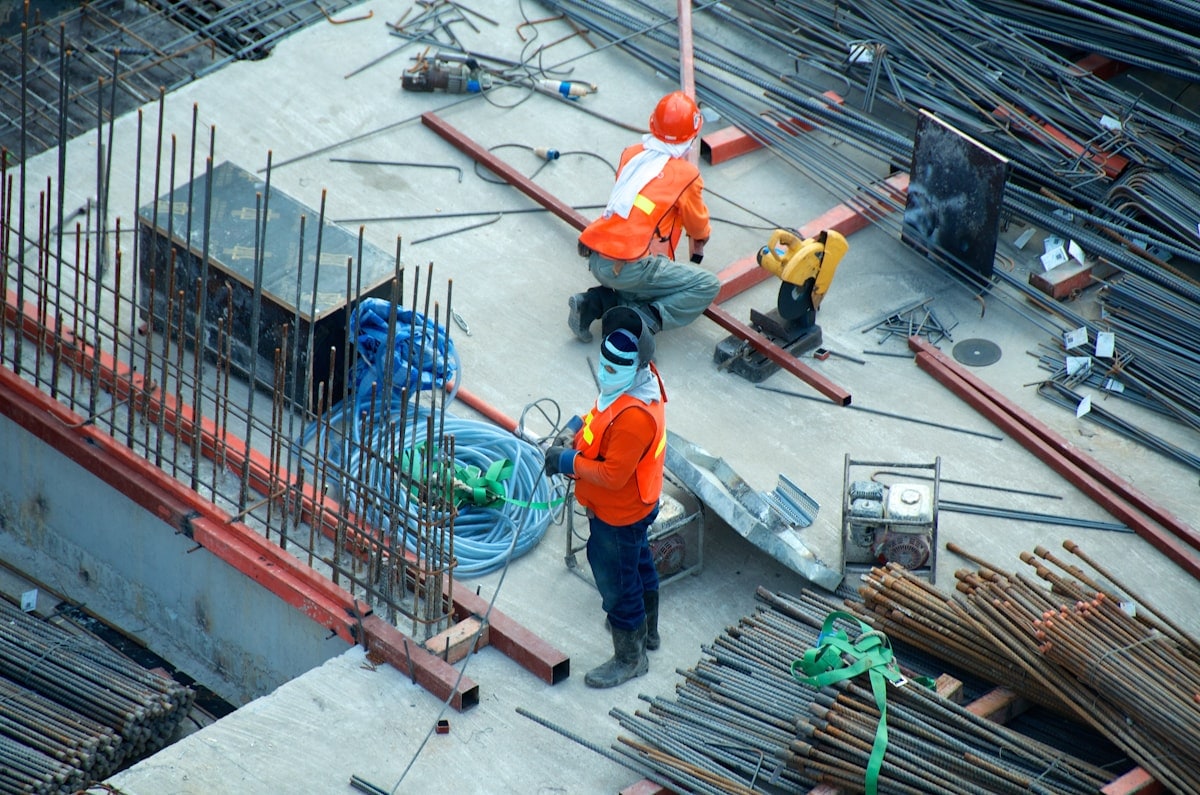Construction workers with PPE on a building site